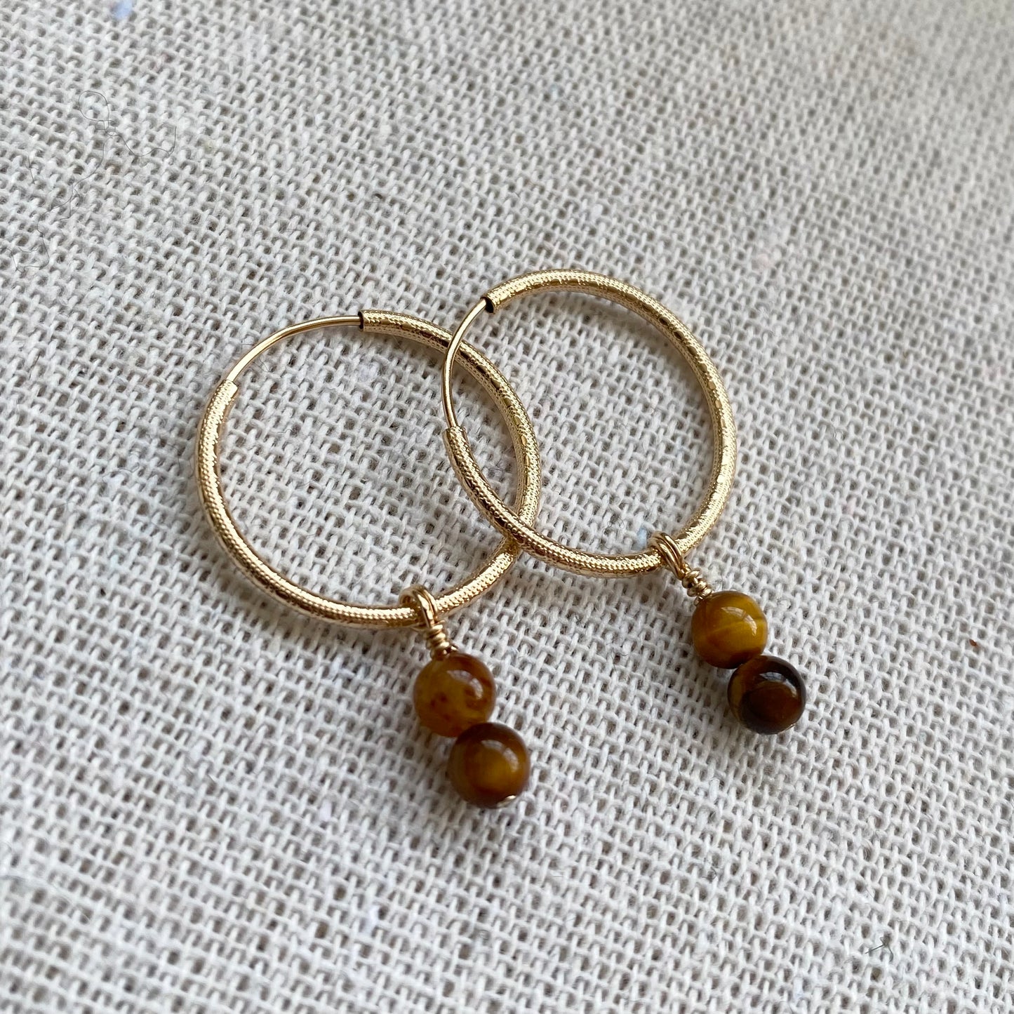 Precious Charms on Gold Patterned Hoops