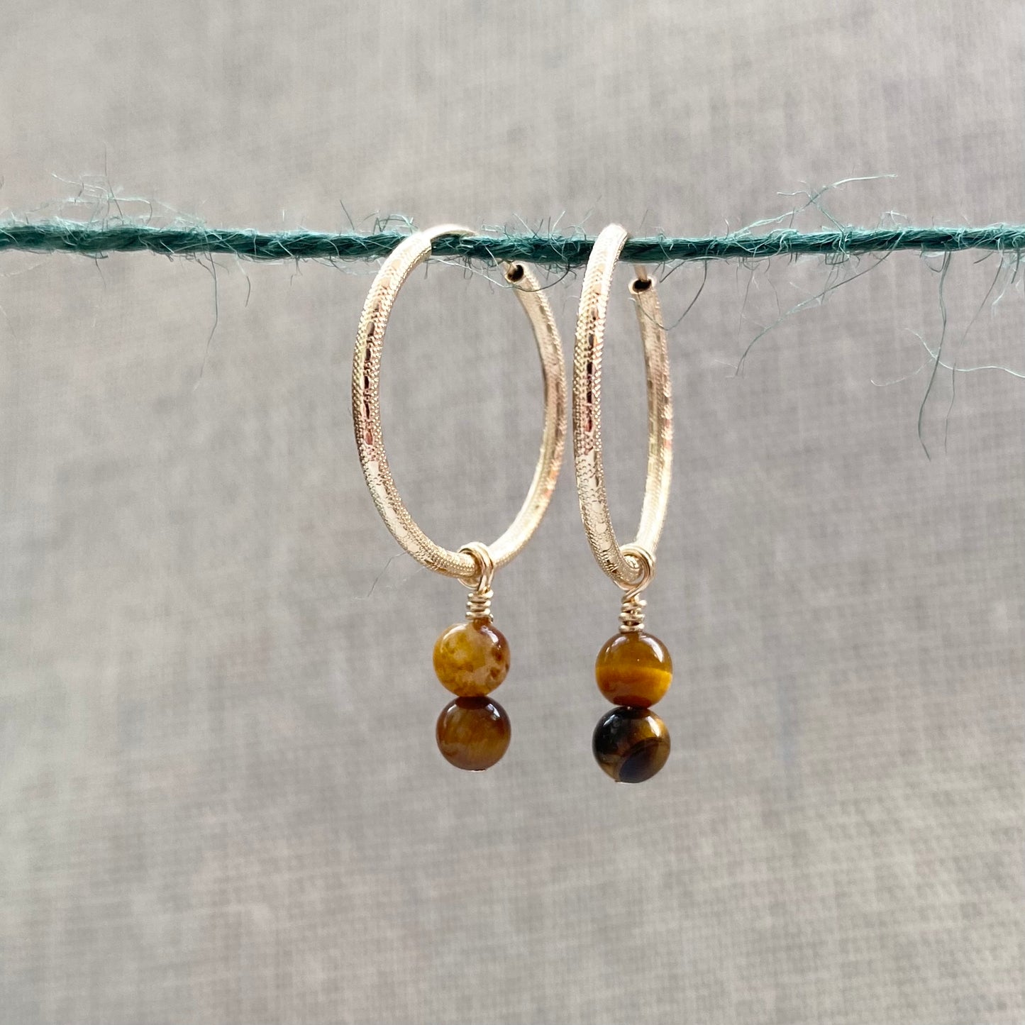 Precious Charms on Gold Patterned Hoops